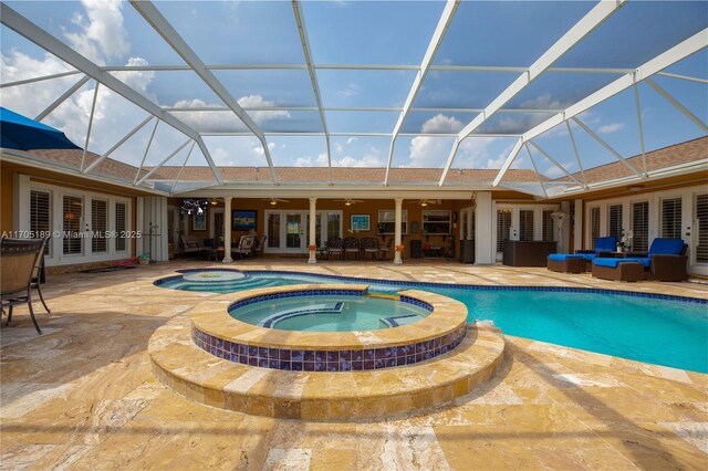 view of pool featuring an in ground hot tub, french doors, an outdoor living space, and a lanai