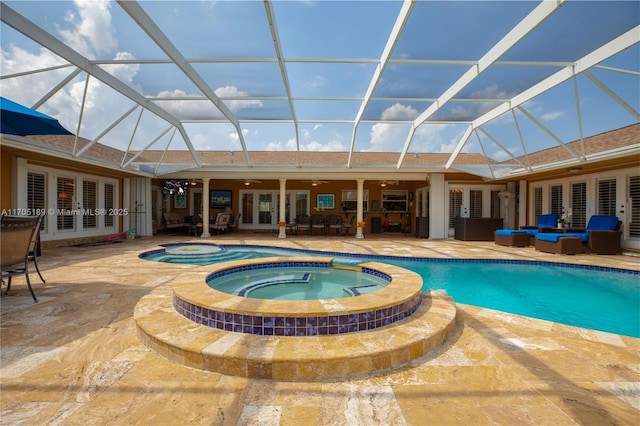 view of pool featuring an in ground hot tub, french doors, an outdoor living space, and a lanai