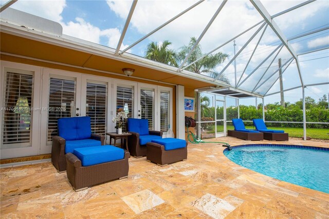 view of swimming pool featuring a patio and glass enclosure