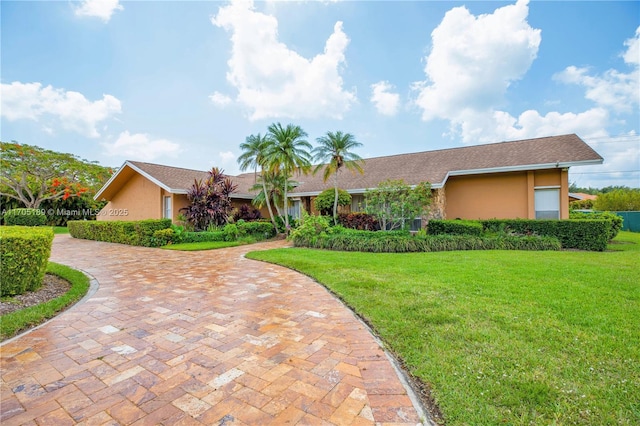 7720 SW 183rd Ter, Palmetto Bay, FL 33157 - ranch-style home featuring a front lawn
