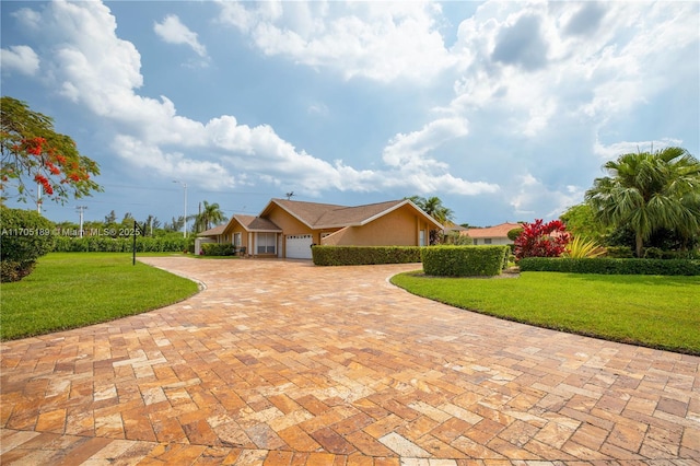 7720 SW 183rd Ter, Palmetto Bay, FL 33157 - ranch-style home with a garage and a front lawn