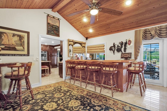 7720 SW 183rd Ter, Palmetto Bay, FL 33157 - bar featuring wood ceiling, high vaulted ceiling, ceiling fan, and light tile patterned flooring