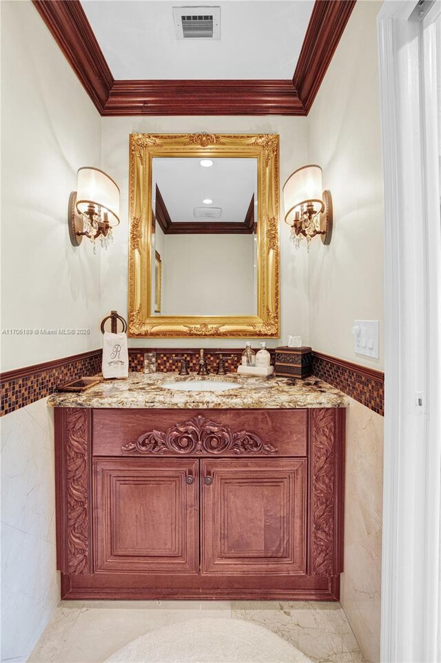 bathroom featuring vanity, walk in shower, and crown molding