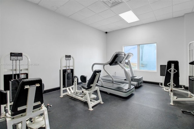 exercise room featuring a paneled ceiling