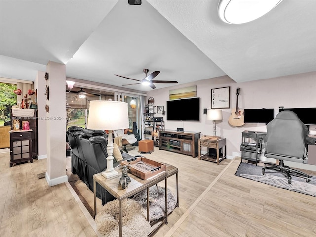 living room with hardwood / wood-style flooring and ceiling fan