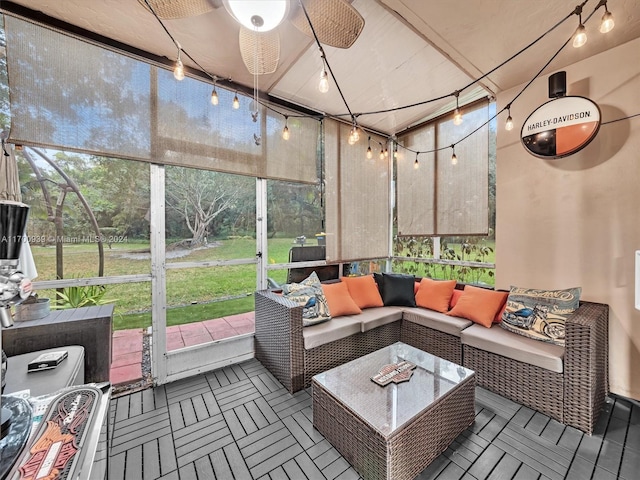 sunroom / solarium featuring ceiling fan