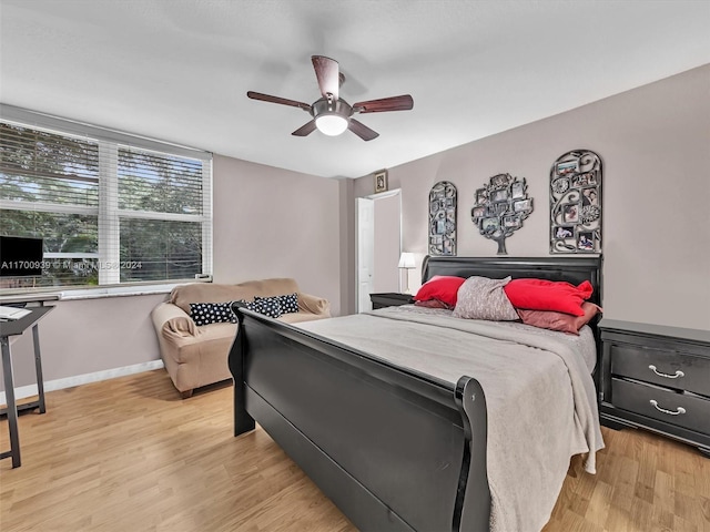 bedroom featuring light hardwood / wood-style flooring and ceiling fan