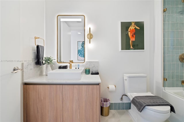 full bathroom with vanity, toilet, and tiled shower / bath