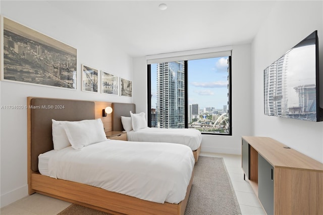 bedroom with light tile patterned floors