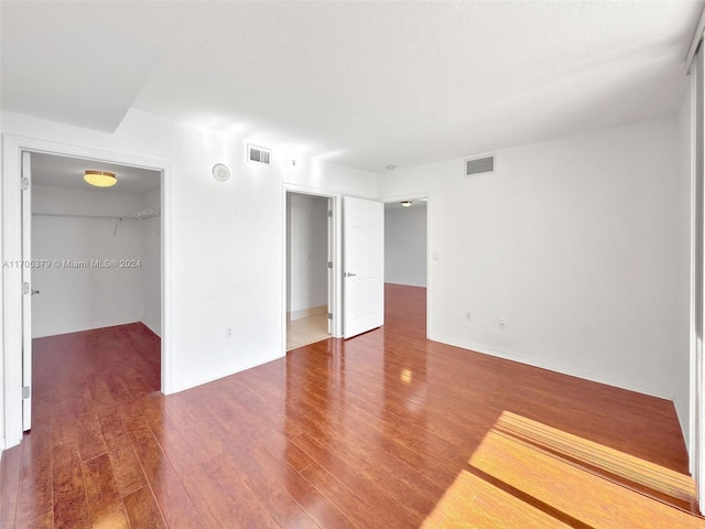 empty room featuring dark wood-type flooring