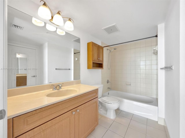 full bathroom featuring tile patterned floors, vanity, toilet, and tiled shower / bath