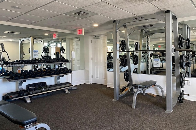 exercise room featuring a drop ceiling