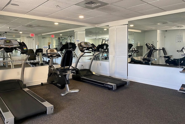 workout area featuring a paneled ceiling