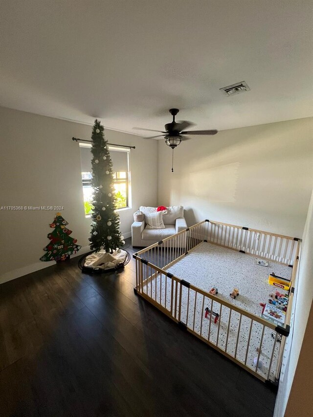 unfurnished living room with hardwood / wood-style floors and ceiling fan