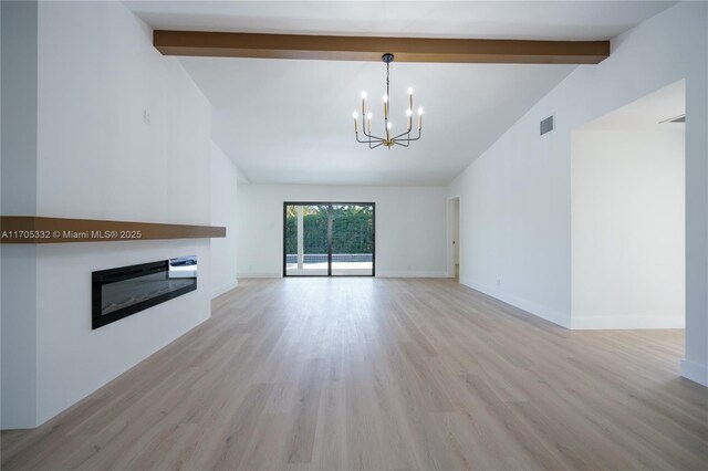 unfurnished living room featuring a notable chandelier, lofted ceiling with beams, and light wood-type flooring