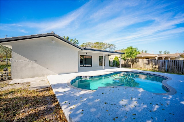 view of pool featuring a patio area and ceiling fan