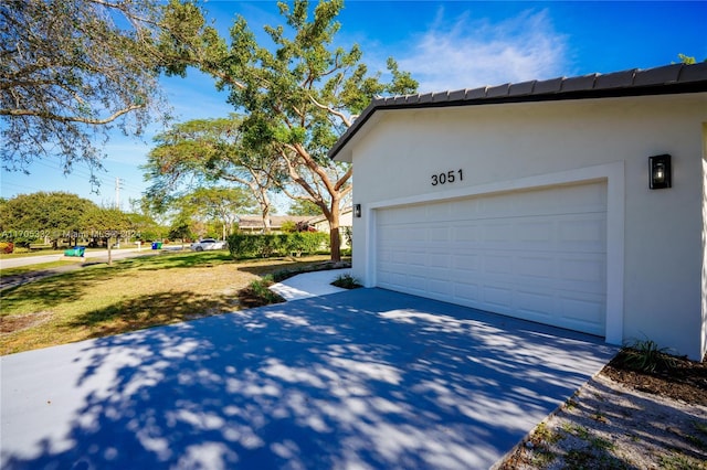 view of side of property with a garage