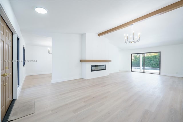 unfurnished living room with an inviting chandelier, lofted ceiling with beams, and light wood-type flooring