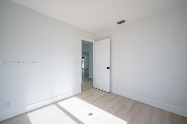 unfurnished room featuring light hardwood / wood-style floors