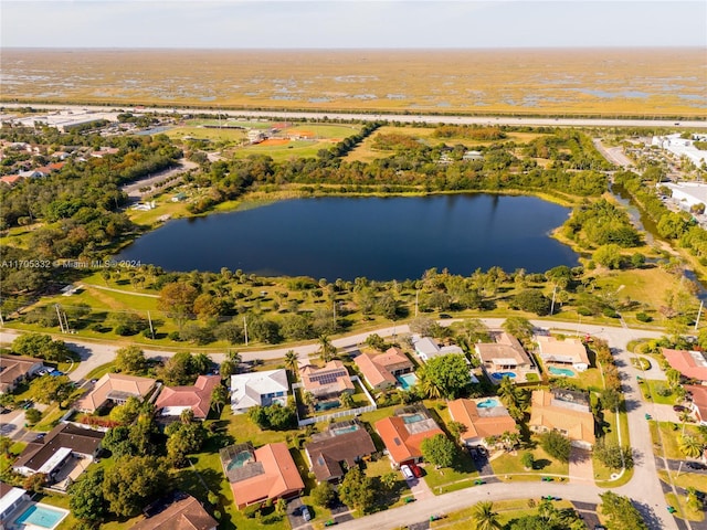 birds eye view of property with a water view