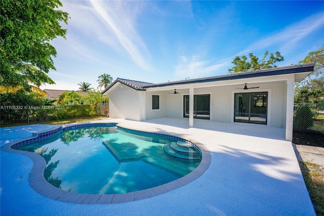 view of pool with ceiling fan and a patio area