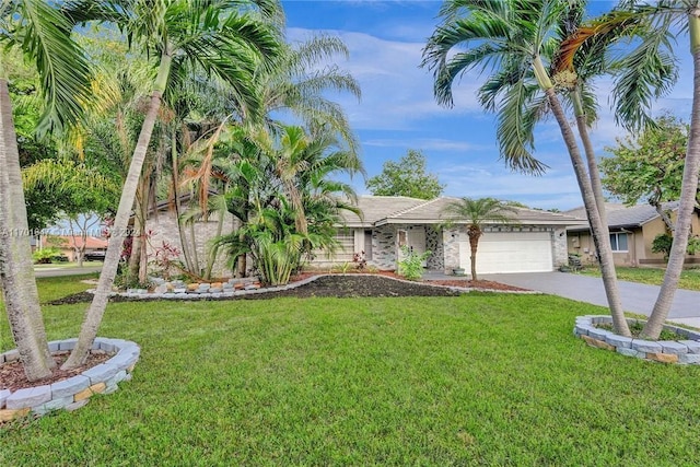 view of front of home featuring a garage and a front yard