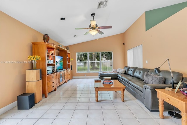 living room featuring vaulted ceiling, ceiling fan, and light tile patterned flooring