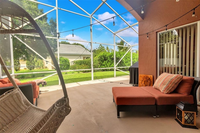 view of patio featuring glass enclosure