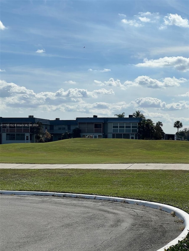 view of home's community with a lawn