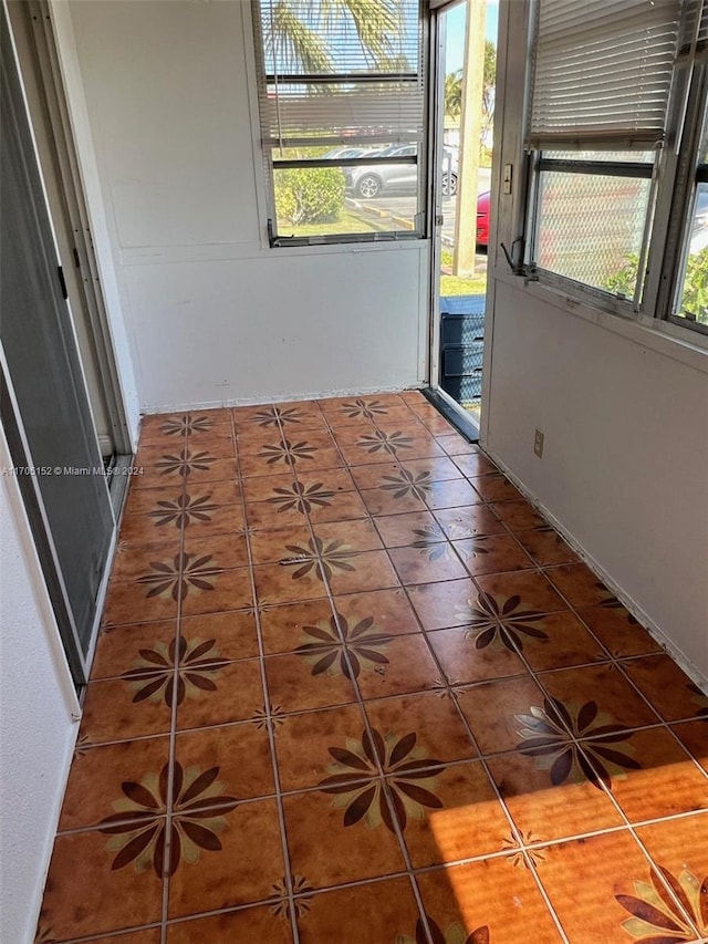 interior space featuring tile patterned flooring and a healthy amount of sunlight