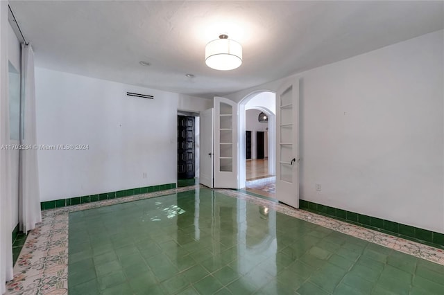 spare room featuring tile patterned floors