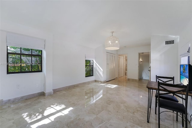 unfurnished dining area featuring a healthy amount of sunlight