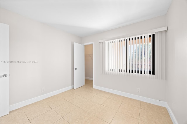 spare room with light tile patterned floors