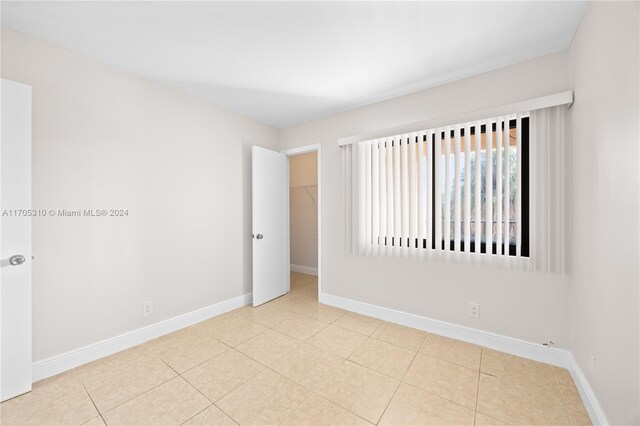 10001 W Atlantic Blvd Unit 316, Coral Springs, FL 33071 - spare room with tile patterned flooring