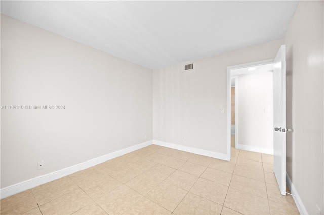 10001 W Atlantic Blvd Unit 316, Coral Springs, FL 33071 - spare room featuring baseboards and light tile patterned flooring