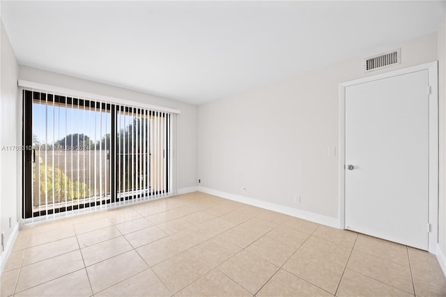 spare room with light tile patterned flooring