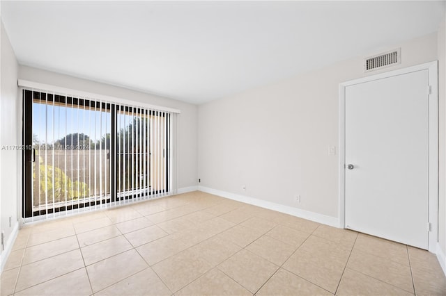 10001 W Atlantic Blvd Unit 316, Coral Springs, FL 33071 - empty room with baseboards and tile patterned floors