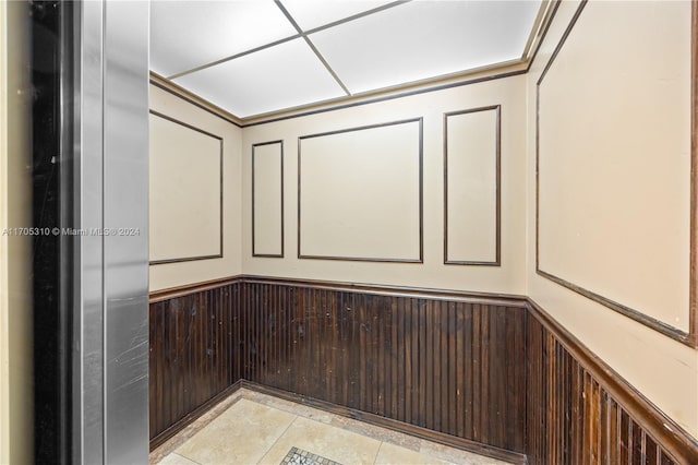 10001 W Atlantic Blvd Unit 316, Coral Springs, FL 33071 - elevator with a decorative wall and wainscoting