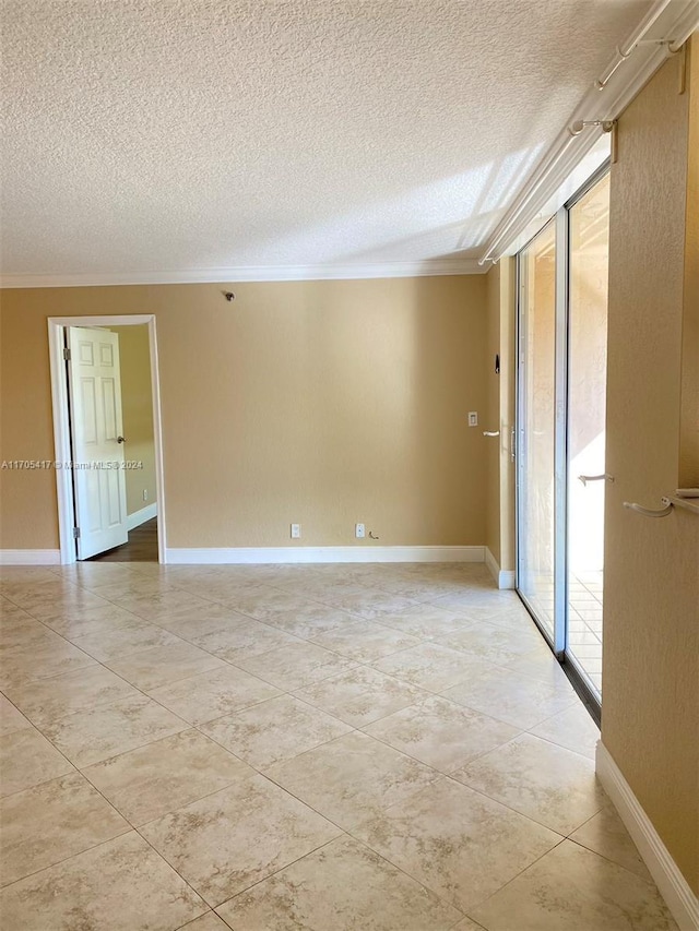 unfurnished room with a healthy amount of sunlight, a textured ceiling, and crown molding