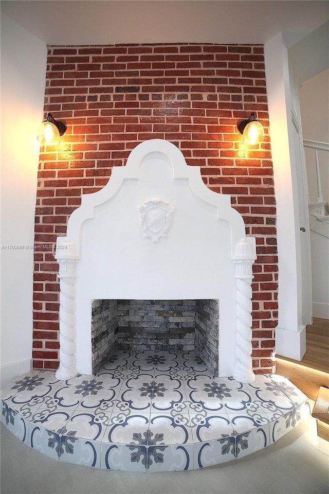 interior details with hardwood / wood-style flooring and a fireplace