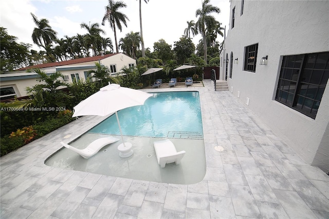 view of pool featuring a patio