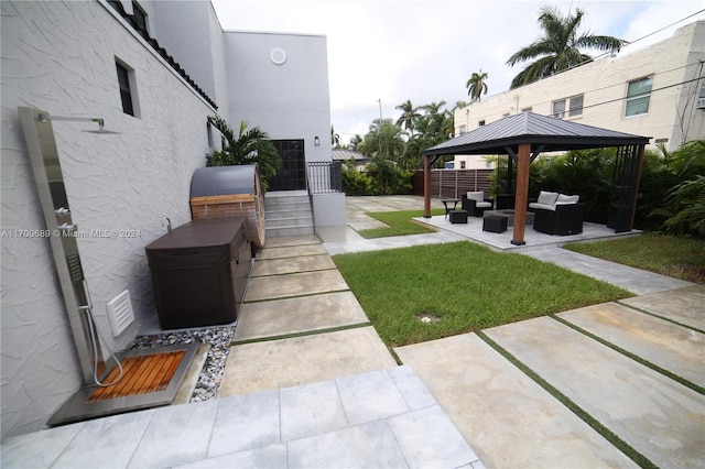 view of yard with a gazebo, an outdoor hangout area, and a patio