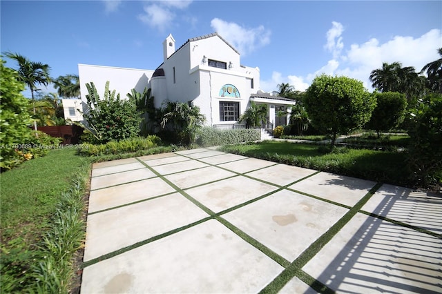 mediterranean / spanish-style house featuring a patio