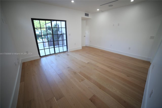 unfurnished room with light hardwood / wood-style flooring