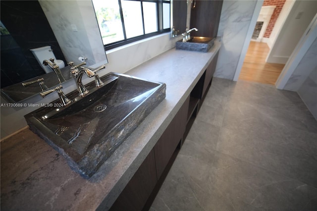 bathroom featuring sink and toilet