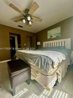 tiled bedroom with ceiling fan