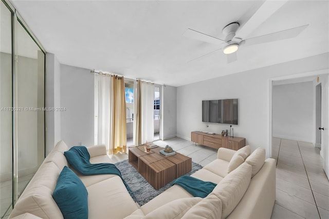 tiled living room featuring ceiling fan