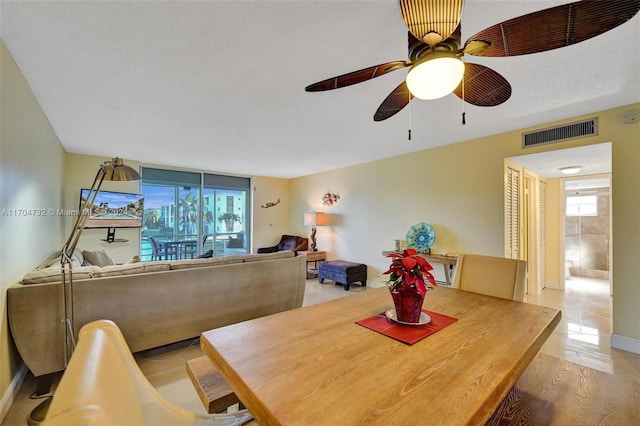 dining room with light hardwood / wood-style flooring and ceiling fan