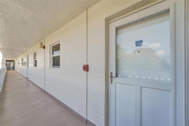 entrance to property with a balcony