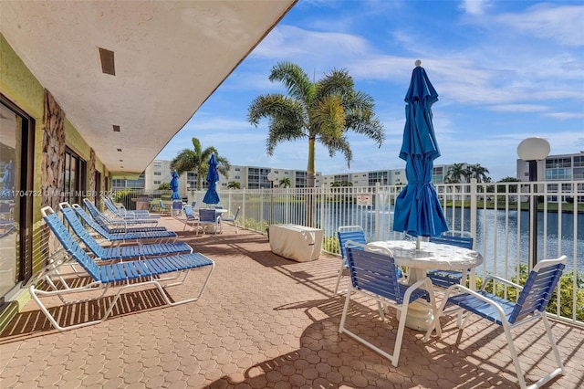 view of patio featuring a water view